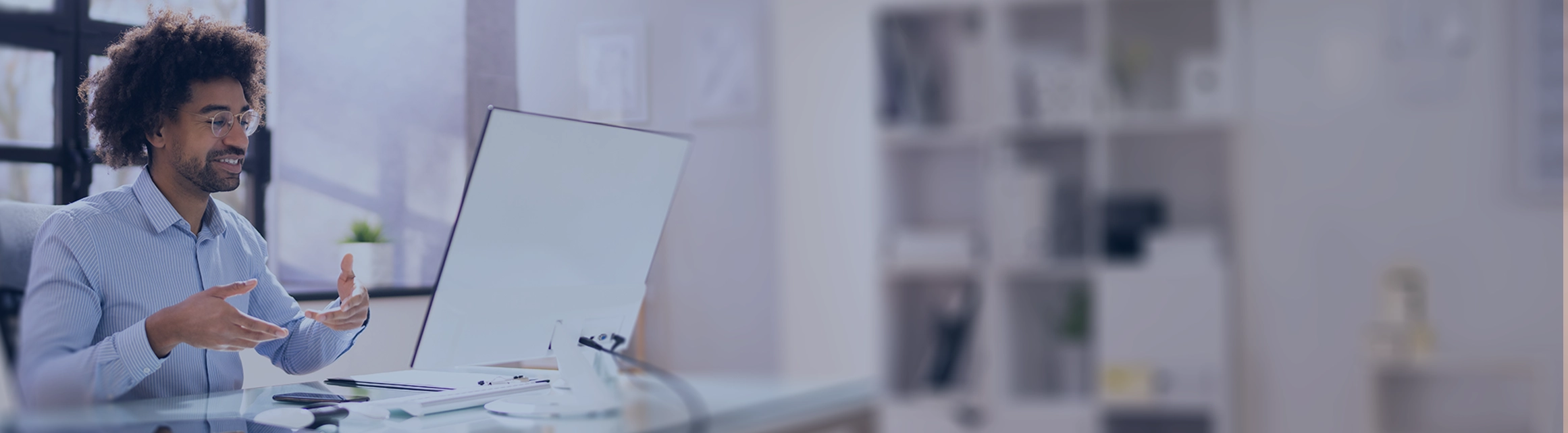 Man is giving a webinar presentation at his desk