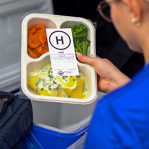 PAR employees delivering meals with Meals on Wheels Organization.