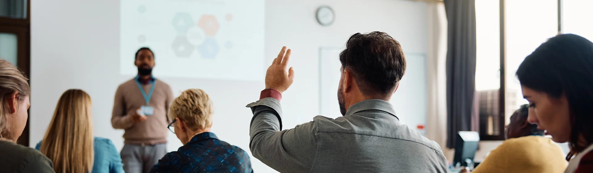 a school psychologist attending a PAR workshop raises his hand to ask a question